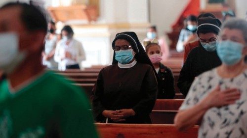 People pray during a mass at the Matagalpa Cathedral in Matagalpa, Nicaragua, on August 19, 2022. - ...