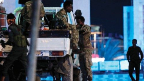 Security forces patrol near the Hayat Hotel after an attack by Al-Shabaab fighters in Mogadishu on ...