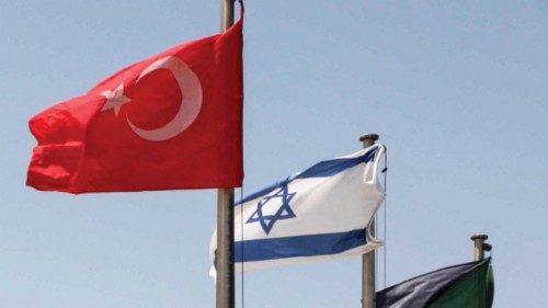 The flags of (L to R) Turkey and Israel fly at a war memorial in Latrun, about 30 kilometres west of ...