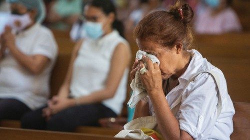 A parishioner reacts during a mass at Metropolitan Cathedral in Managua, Nicaragua August 21, 2022. ...