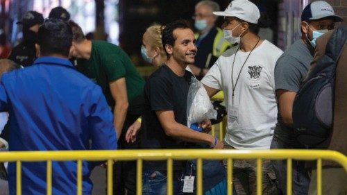 Migrants from Texas arrive at the Port Authority bus terminal in New York, U.S., August 17, 2022. ...