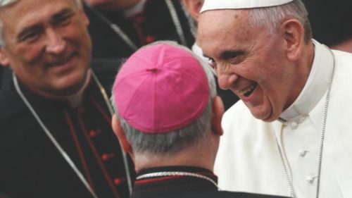Pope Francis smiles as he greets bishops as he arrives for a meeting with novices at the Paul VI ...