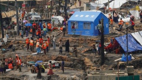 FILE PHOTO: Rohingya refugees rebuild their shelters after a massive fire broke out two days ago in ...