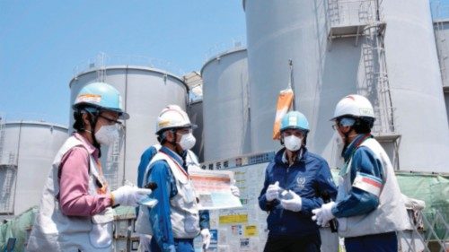 Director General of the International Atomic Energy Agency (IAEA) Rafael Grossi (2nd-R) stands in ...