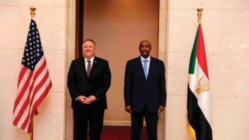 A handout picture provided by Sudan's Foreign Media Council shows US Secretary of State Mike Pompeo ...