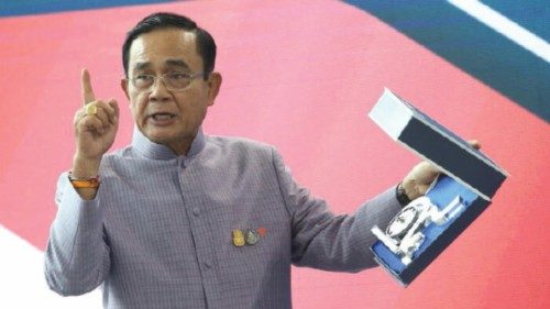 epa08884847 Thai Prime Minister Prayuth Chan-ocha displays a souvenir watch with the number nine of ... epa08884847 Thai Prime Minister Prayuth Chan-ocha displays a souvenir watch with the number nine of ...