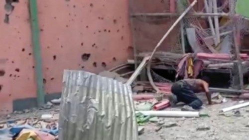A man crouches to inspect a damaged playground following an air strike in Mekelle, the capital of ... A man crouches to inspect a damaged playground following an air strike in Mekelle, the capital of ...