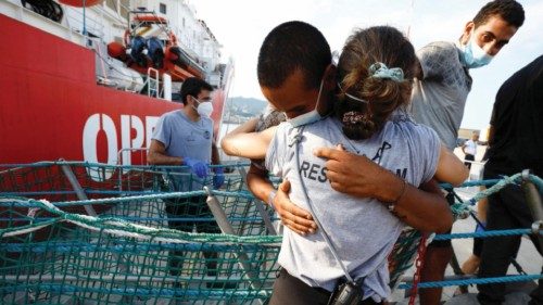 Migrants disembark from Open Arms rescue boat after arriving at Messina port, Sicily, Italy August ...