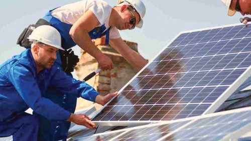 Male team engineers installing stand-alone solar photovoltaic panel system. Electricians mounting ...