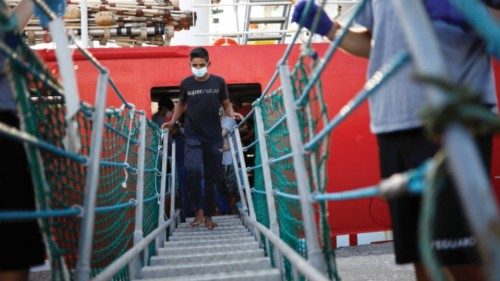 Migrants disembark from Open Arms rescue boat after arriving at Messina port, Sicily, Italy August ...