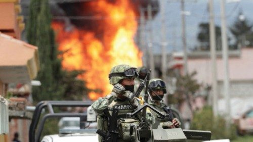 Mexican soldiers guard the perimeter set by authorities due to the explosion of a gas pipeline ...