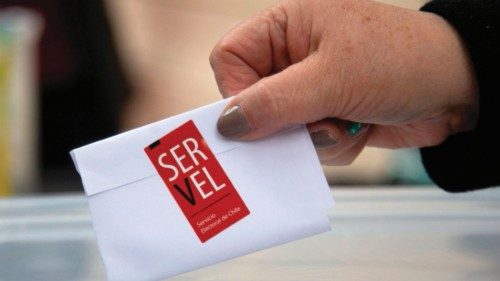 (FILES) In this file photo taken on May 13, 2021 an election service worker shows a sealed ballot in ... (FILES) In this file photo taken on May 13, 2021 an election service worker shows a sealed ballot in ...