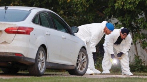 A police forensics team investigates a crime scene after multiple people were killed and injured in ...