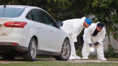 A police forensics team investigates a crime scene after multiple people were killed and injured in ... A police forensics team investigates a crime scene after multiple people were killed and injured in ...