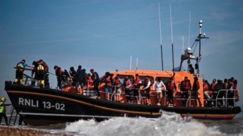 (FILES) In this file photo taken on June 15, 2022 Migrants, picked up at sea attempting to cross the ...