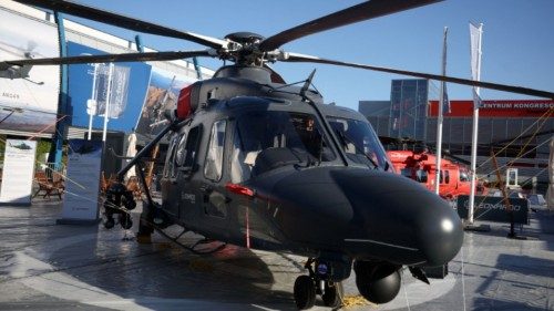 A Leonardo AW149 multifunctional helicopter sits outside a hall before the opening ceremony of the ...
