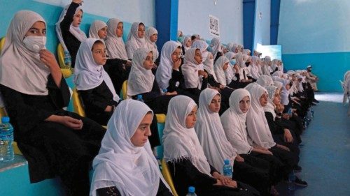 Afghan school girls sit in a classroom as the new academic year begins in Kandahar on September 7, ...