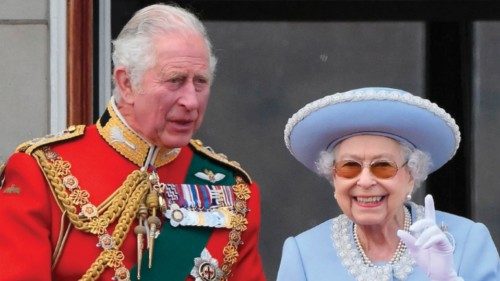 (FILES) In this file photo taken on June 02, 2022 Britain's Queen Elizabeth II (R) stands with ...