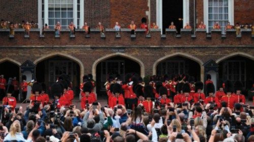 Members of the public listen to the primary proclamation of Britain's new King, King Charles III, ...