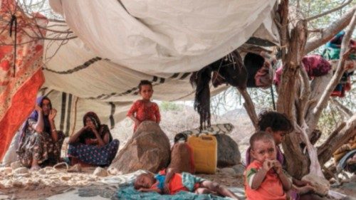 Internally displaced people seat in a tent in the makeshift camp where they are sheltered in the ...