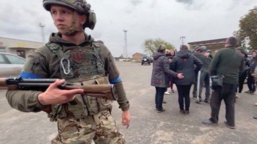 Residents greet soldiers in a location given as Kozacha Lopan, Kharkiv Region, Ukraine in this ... Residents greet soldiers in a location given as Kozacha Lopan, Kharkiv Region, Ukraine in this ...