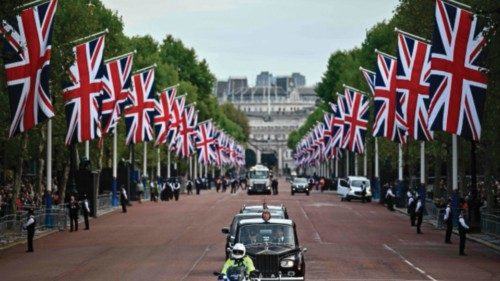Britain's King Charles III is driven down the Mall to Buckingham Palace in central London on ...