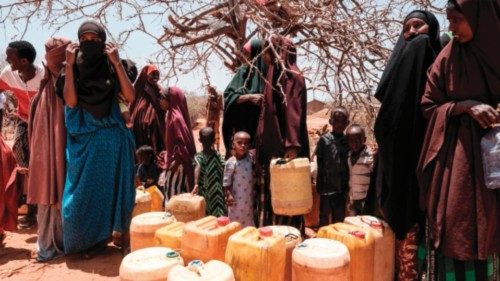 People wait to fill their water tanks as they receive water delivery by the Save the Children twice ... People wait to fill their water tanks as they receive water delivery by the Save the Children twice ...