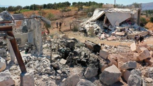 This picture shows damaged buildings following a reported pro-regime forces bombing, in the Syrian ...