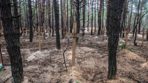 Crosses with numbers are seen at an improvised cemetery of unidentified civilians and Ukrainian ...