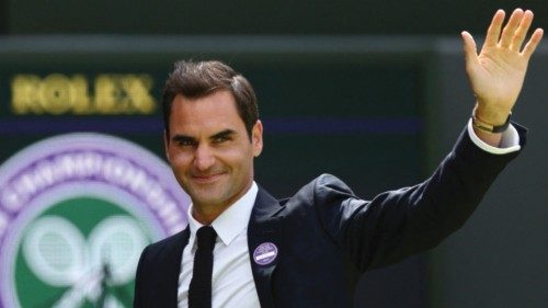 (FILES) In this file photo taken on July 3, 2022 Swiss tennis player Roger Federer waves during the ...