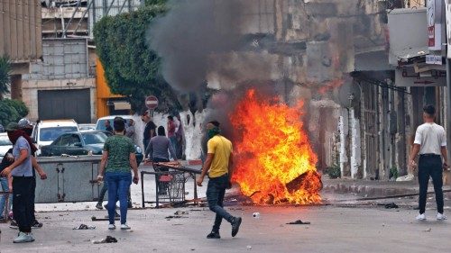 Palestinian protesters clash with Palestinian security forces in Nablus in the occupied West Bank on ...