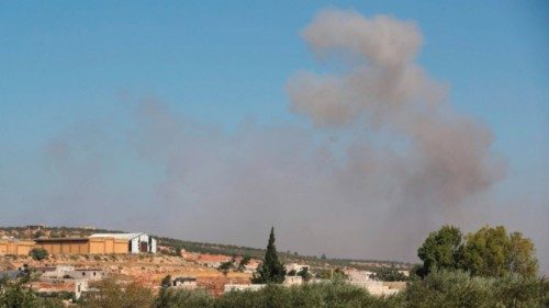 Smoke billows, following a reported airstrike, near Syria's rebel-held northwestern city of Idlib on ...