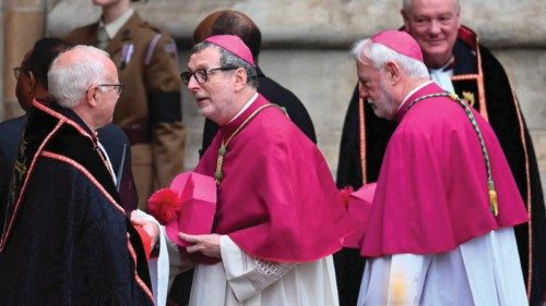 Representatives from the Vatican arrive to take their seats inside Westminster Abbey in London on ...