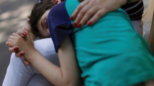 Tetyana Ponomarchuk, deputy head of social care, 61, comforts Tanya, 12, who is autistic and does ... Tetyana Ponomarchuk, deputy head of social care, 61, comforts Tanya, 12, who is autistic and does ...