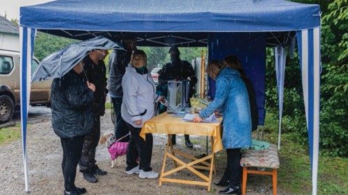 epa10201042 Locals attend a referendum at a polling station in Luhansk, Ukraine, 23 September 2022. ...