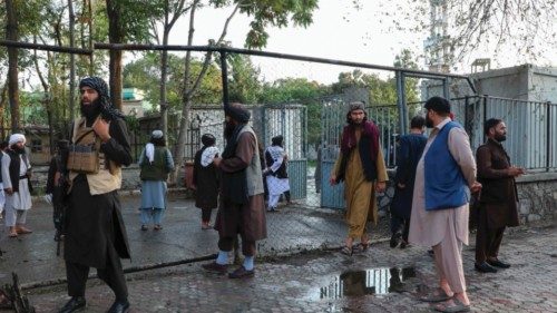Taliban fighters investigate at a site after a blast near the Wazir Mohammad Akbar Khan Mosque that ...