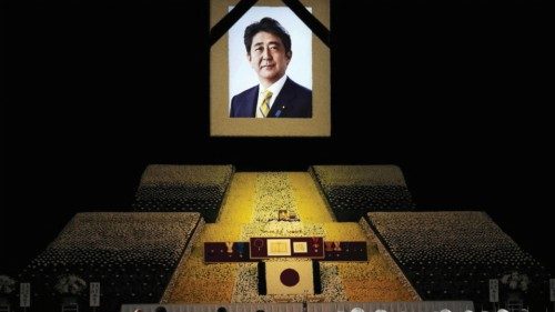 A portrait of former Japanese Prime Minister Shinzo Abe hangs on the stage during the state funeral ...