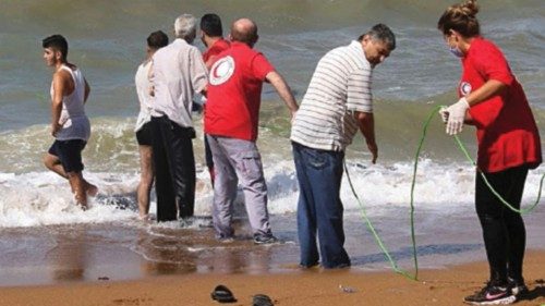 A handout picture released by the Syrian Red Crescent on September 23, 2022, shows rescuers pulling ...