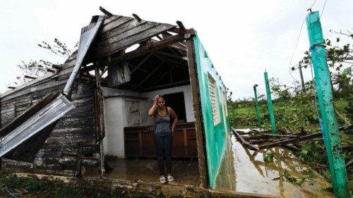 TOPSHOT - Tobacco company worker Caridad Alvarez stands in her house destroyed by Hurricane Ian, in ...