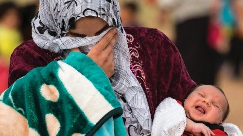 A young mother crosses the border from Syria and becomes a refugee. She carries her one-month-old ... A young mother crosses the border from Syria and becomes a refugee. She carries her one-month-old ...