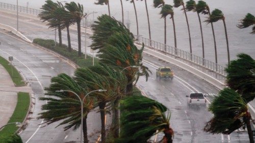 TOPSHOT - SARASOTA, FL - SEPTEMBER 28: Motorists travel across the John Ringling Causeway as ...