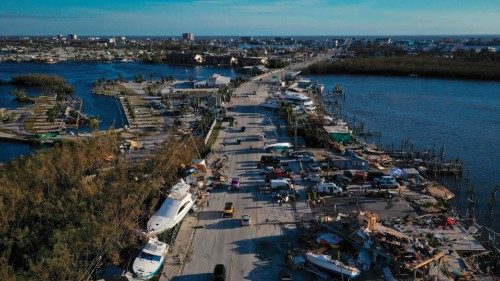 TOPSHOT - SAN CARLOS ISLAND, FLORIDA - SEPTEMBER 29: In this aerial view, boats sit grounded in a ...