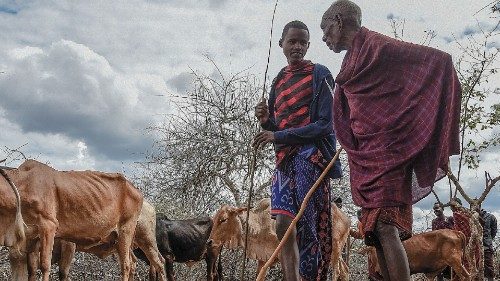 Maasai men attend a livestock auction at the Msomera village in Handeni, Tanzania, on July 15, 2022. ...