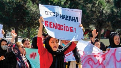 Afghan women display placards and chant slogans during a protest they call ?Stop Hazara genocide? a ...