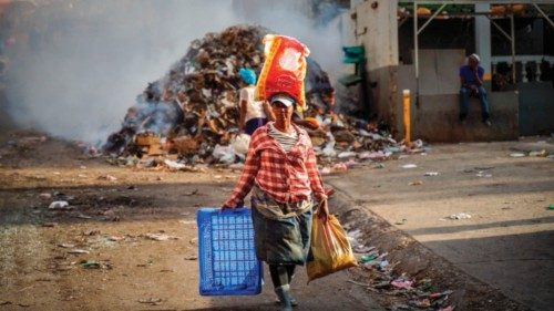 A woman walks in the streets left empty by a general strike in Port-au-Prince, Haiti, September 28, ...