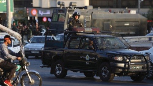 A riot police vehicle rides in a street in Tehran, Iran, October 3, 2022. WANA (West Asia News ...