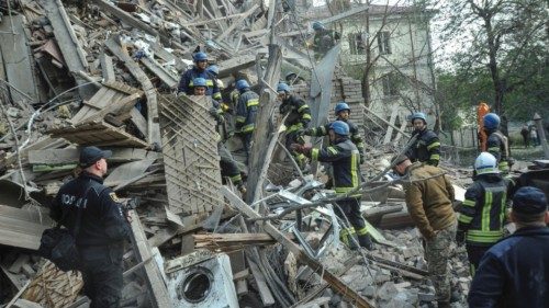 Rescuers work at the site of a residential building heavily damaged by a Russian missile strike, ... Rescuers work at the site of a residential building heavily damaged by a Russian missile strike, ...