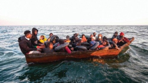 TOPSHOT - Migrants from sub-Saharan Africa sit in a makeshift boat that was being used to ...