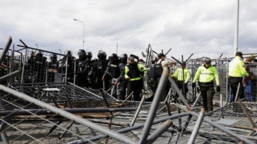 FILE PHOTO: Police organize fallen fences after relatives of inmates clashed with police while ...