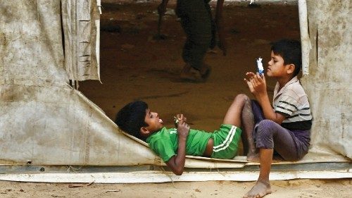 Rohingya refugee children play inside a abandon warehouse in Kutupalong refugee camp in Ukhia, on ...